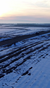 航拍雪地上的公路白雪皑皑视频