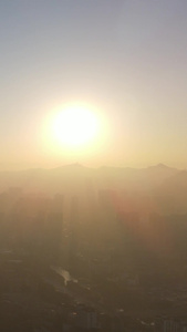 航拍城市清晨迷雾日出视频