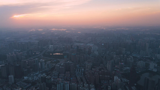 航拍日落时晚霞下的武汉城市建筑群视频