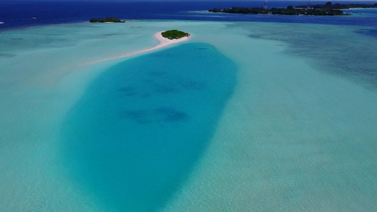 白沙背景的绿松石环礁环礁湖海景豪华海岸海滩度假视频