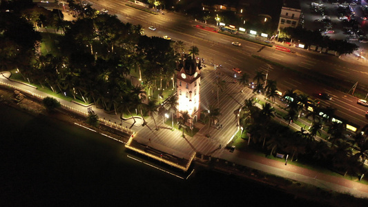 航拍海南海口海甸河畔的海口钟楼夜景灯光秀视频