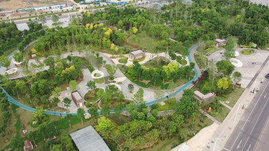 航拍郑州金水市民公园城市绿色植被健康步道视频
