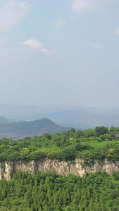 航拍夏季山峰及山上的古建筑自然风光视频