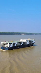 航拍巨轮货船行驶在平原长江内陆航运视频