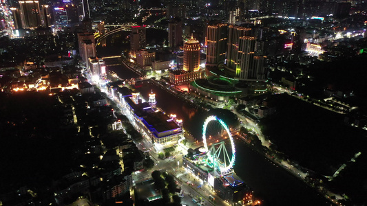 航拍广东中山岐江河兴中广场幻彩摩天轮夜景视频