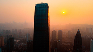 4K航拍夕阳下的重庆观音桥CIC地标建筑30秒视频
