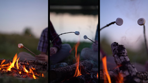 在露营附近的营火炉上拼凑了年轻的观光客烤棉花糖11秒视频