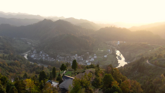 航拍日落山谷中的徽州村落视频视频