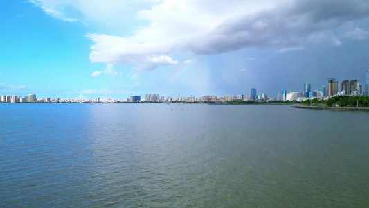 海南海口雨过天晴高视角航拍城市上空双彩虹视频