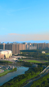 航拍大气杭州奥体中心博览城全景蓝天阳光蓝天白云视频