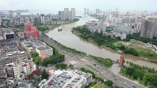 航拍中国海南海口海甸河畔的海口钟楼视频