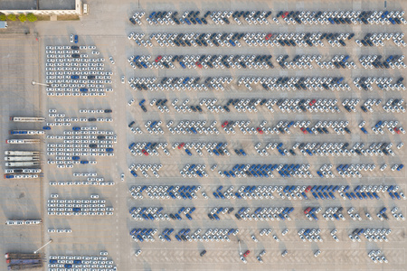 航拍工业园区汽车生产厂家装满待售汽车的停车场素材视频