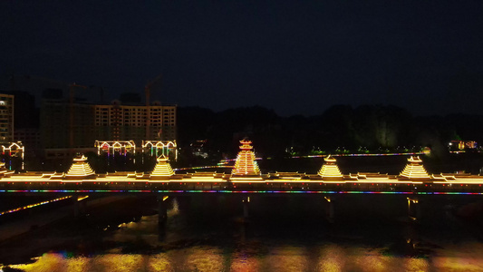 少数民族特色建筑鼓楼风雨桥夜景航拍视频