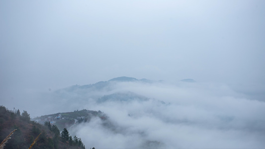 4K延时春雨绵绵山间云雾围绕宁静山村视频