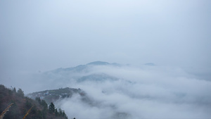 4K延时春雨绵绵山间云雾围绕宁静山村8秒视频