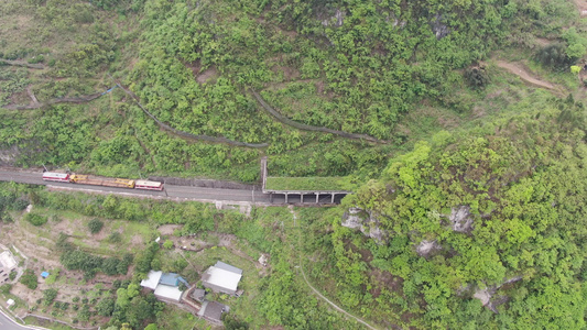 航拍大山中的火车轨道隧道交通视频