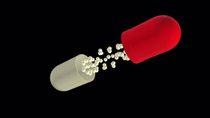 药丸打开并显示内容物没有背景飞行红色和白色药片的慢动作24秒视频