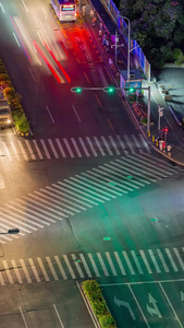 城市道路口夜景光轨车流延时轨道交通视频