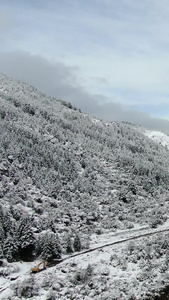 航拍川西高原群山下雪雪景视频四川旅游视频