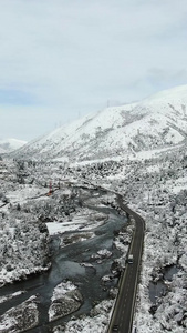 航拍川西高原群山下雪雪景视频高海拔视频