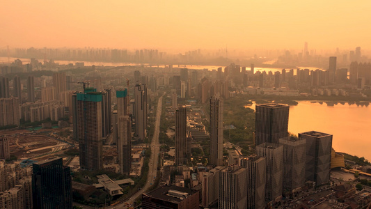 航拍夕阳下的武汉武昌城区和远眺长江大桥视频