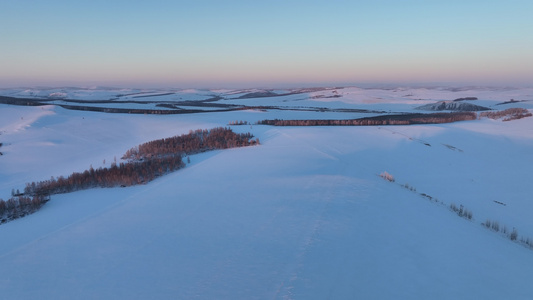 航拍大兴安岭雪景丘陵山地冬天风景视频