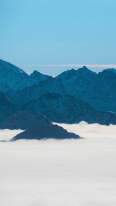 水墨天山山脉山顶云海翻腾延时山脉云海视频