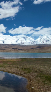 航拍新疆南部5A帕米尔高原景区卡拉库拉胡雪山倒影视频自然风光视频