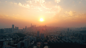 4k航拍夕阳笼罩下的城市落日22秒视频
