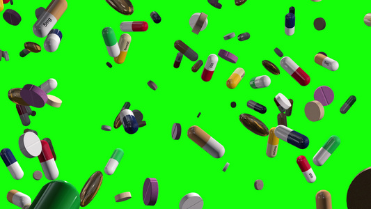 各种多彩药丸在绿色阿尔法上下降视频