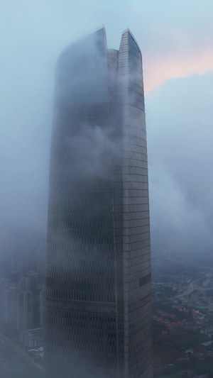 高空航拍云雾中的城市地标天际线商务中心高楼晚霞天空素材城市素材64秒视频