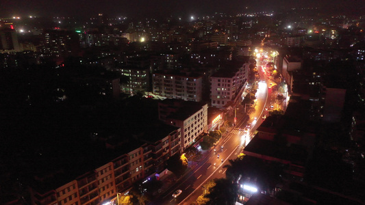 航拍海南省文昌市文城镇中心城区建筑群夜景视频