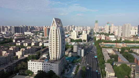 航拍郑州巨型树叶造型建筑城市天际线办公楼视频