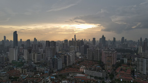 航拍城市风光夕阳晚霞落日余晖天空城市金融商务中心天际线素材52秒视频