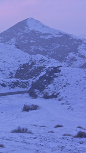 货车行驶在雪乡公路上天空空镜视频