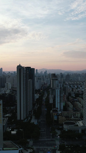 城市清晨日出彩霞高楼建筑竖屏航拍视频