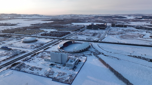 航拍北方寒冷季节的体育场雪景视频