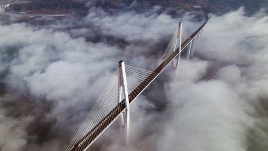 4k航拍云海中的大桥列车风景视频