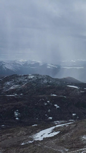 航拍川西高原风雨雪山延时视频