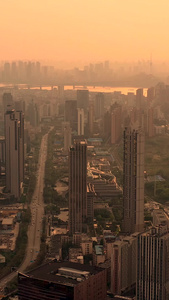 航拍夕阳下的武汉武昌城区和远眺长江大桥视频