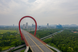航拍武汉光谷跨高速公路九龙大桥城市风光视频50秒视频