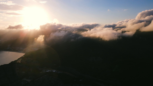 4K落日海滨山峰云层航拍视频视频