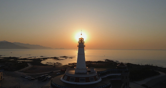 航拍大海灯塔与朝阳视频