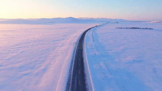 4k航拍夕阳下的雪域草原公路风景视频