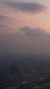 航拍城市夕阳晚霞落日天空蜿蜒的河流桥梁道路素材落日素材视频