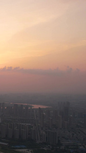 航拍城市夕阳晚霞落日天空蜿蜒的河流桥梁道路素材天空素材视频