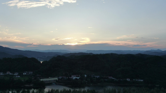 航拍夕阳下大自然山川河流森林视频