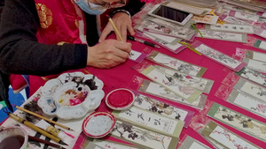 4K中国传统节日春节元宵节庙会游园会传统手艺手绘书签视频素材61秒视频