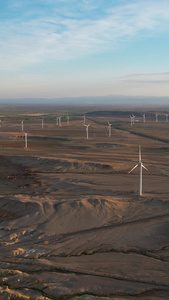 航拍新疆布尔津戈壁中的电力风车视频新能源视频
