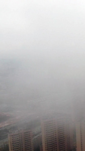 航拍云雾高楼城市航拍视频